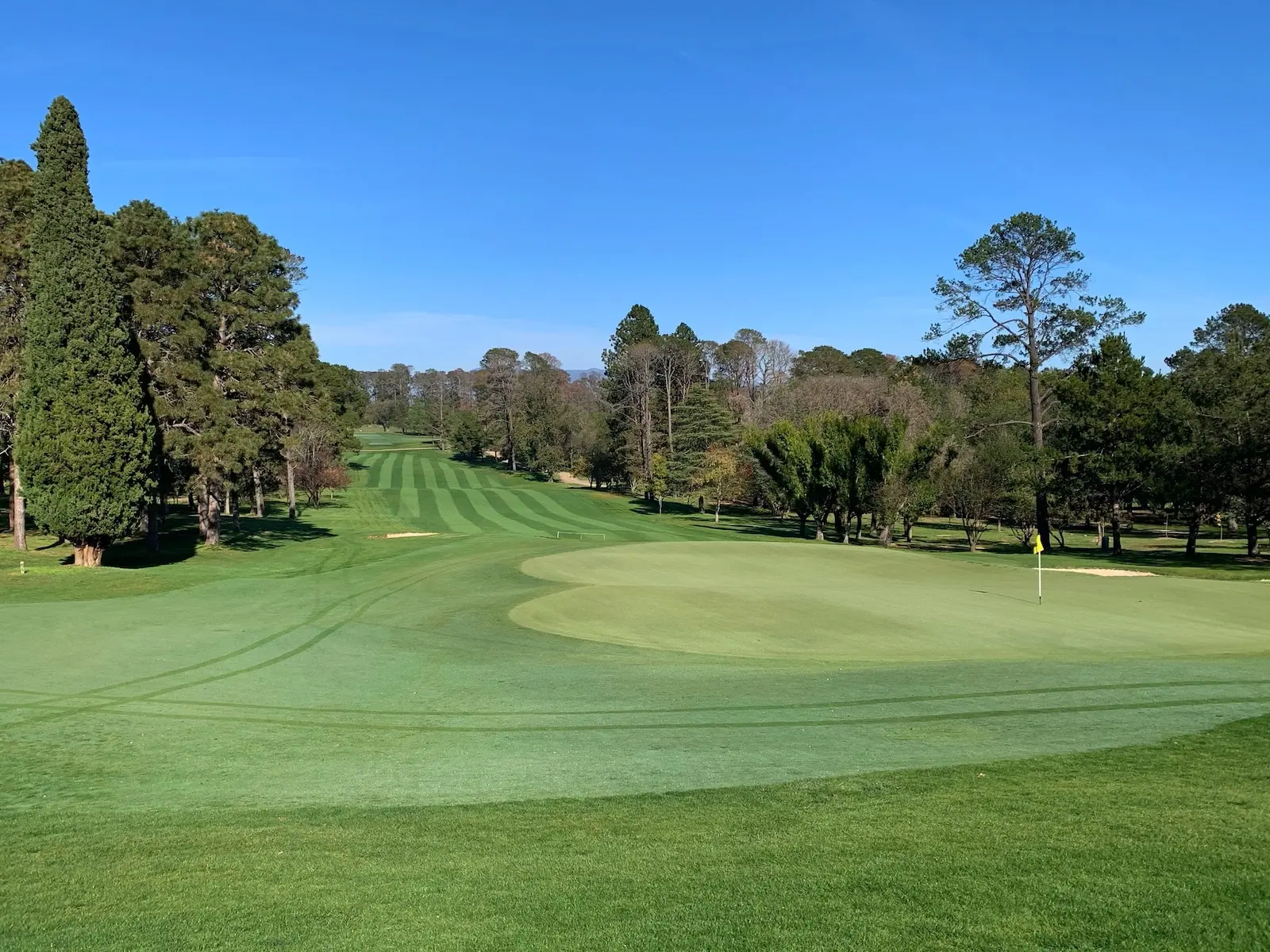 The 18th hole at Royal Canberra Golf Club looking down the fairway from the green.