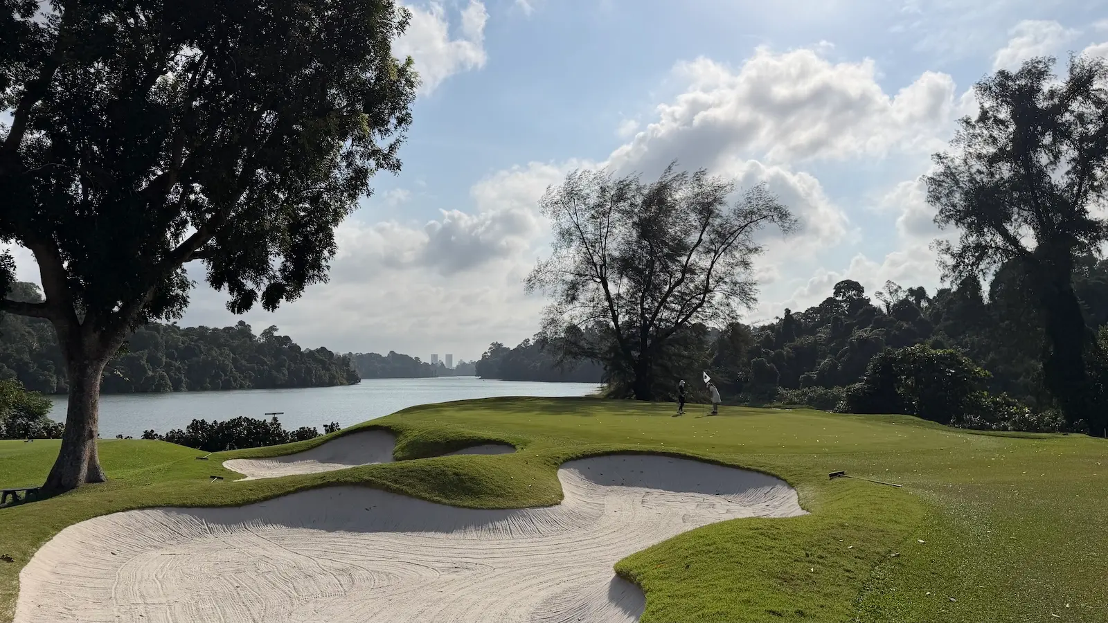 The 1st green complex at Singapore Island Country Club's Bukit course with the MacRitchie Reservoir in the background