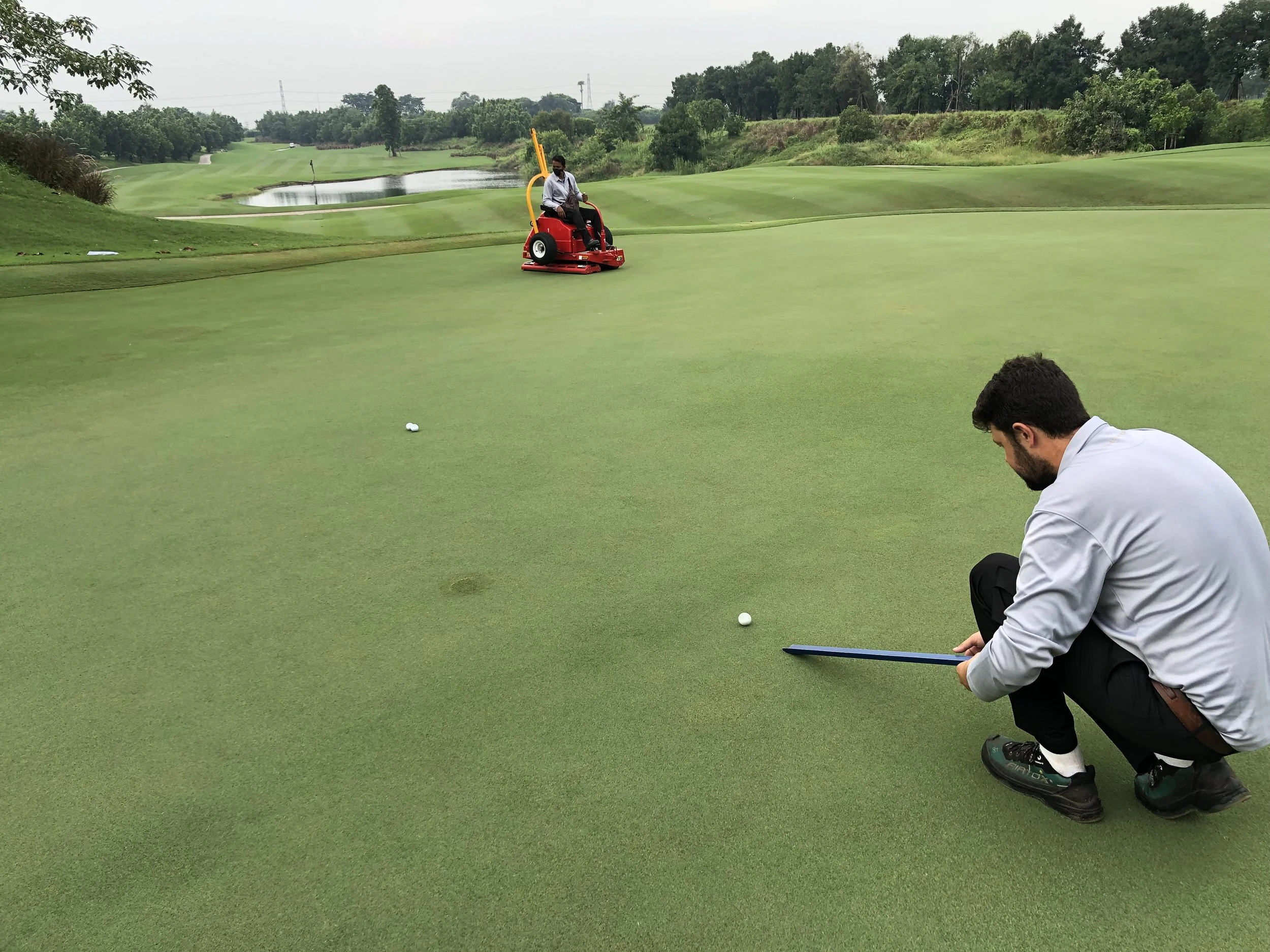 Richard Last measuring the green speed after rolling at Nikanti Golf Club in Thailand